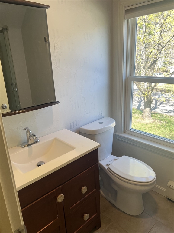 133 Pond Street Sharon, MA 02067 - Photo 16 of 17 a bathroom with a sink a toilet and a window
