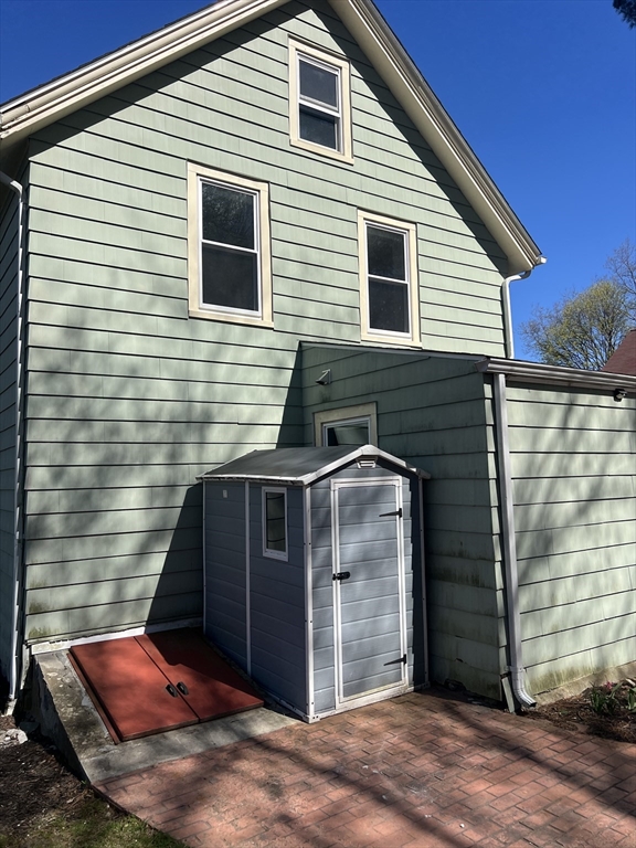 133 Pond Street Sharon, MA 02067 - Photo 3 of 17 a view of a house with large windows