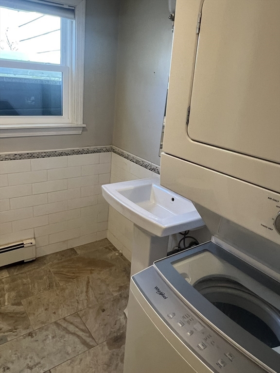 133 Pond Street Sharon, MA 02067 - Photo 9 of 17 a utility room with dryer and window