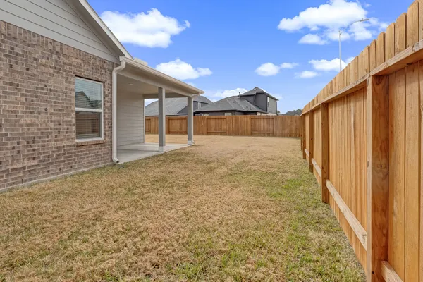 a view of a backyard of the house