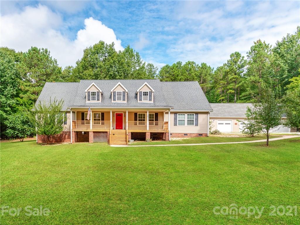 2295 Armenia Road Chester, SC 29706 - Photo 1 of 46 a view of a white house with a big yard and large trees