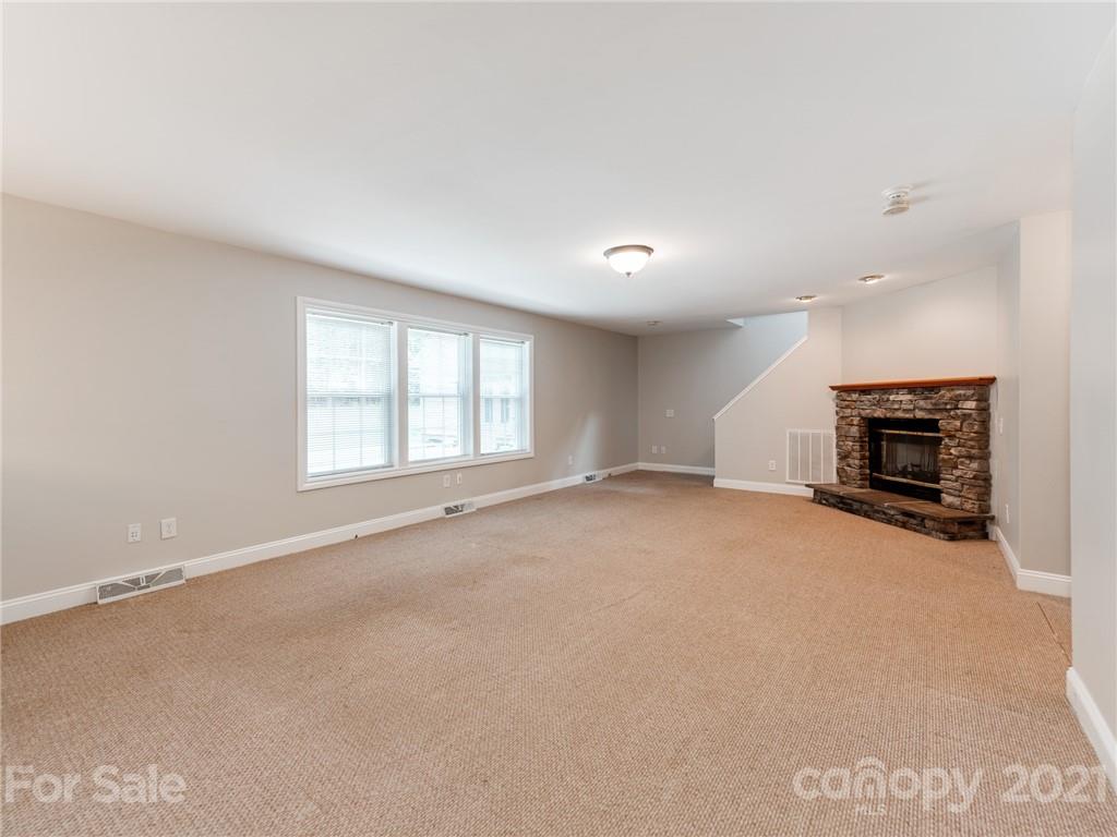 2295 Armenia Road Chester, SC 29706 - Photo 8 of 46 an empty room with fireplace and a window