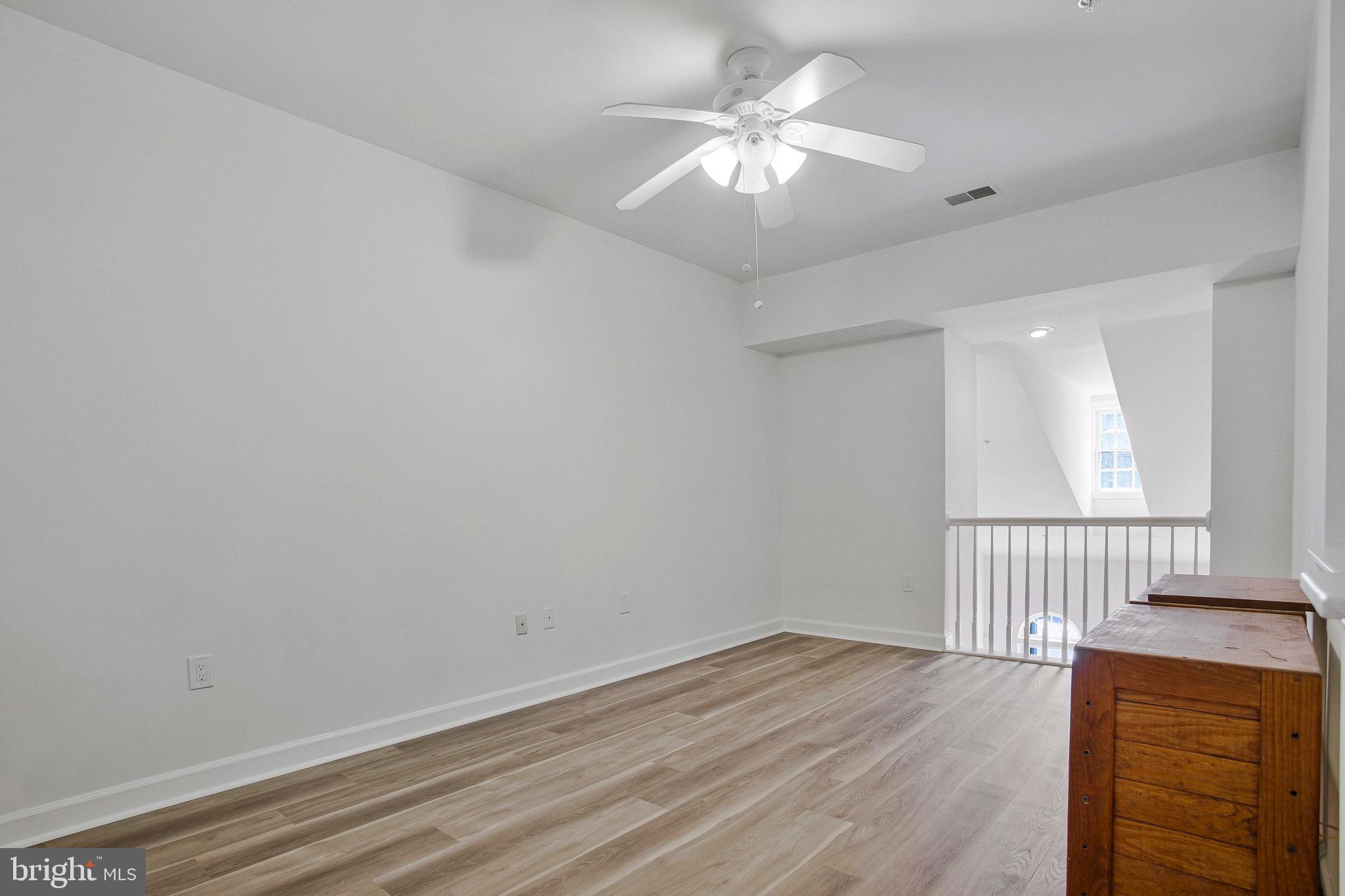 322 Hamlet Circle Edgewater, MD 21037 - Photo 17 of 21 wooden floor in an empty room with a window