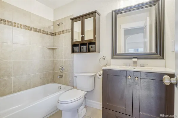 a bathroom with a sink a toilet and a bathtub