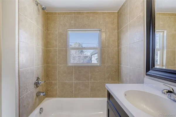 a bathroom with a sink and a bathtub