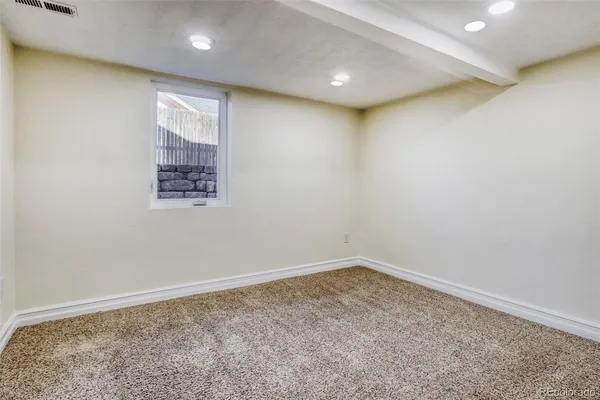an empty room with a empty space and window