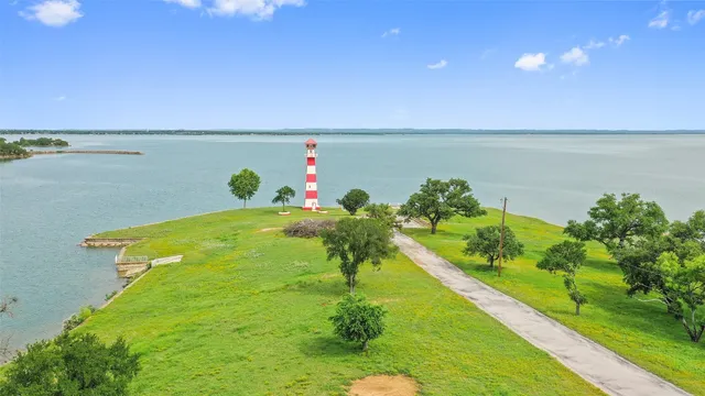 a view of a lake with a big yard