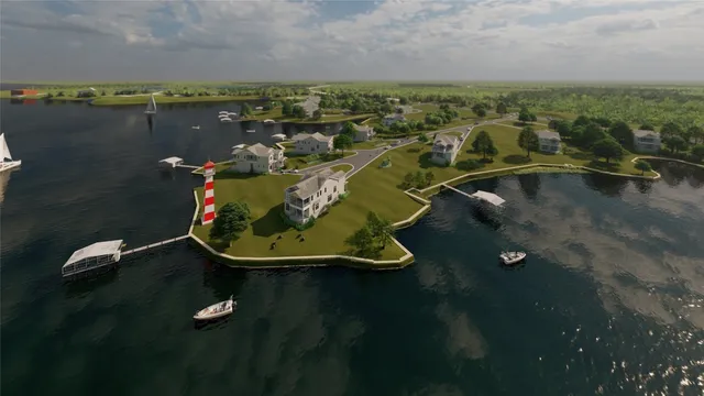 an aerial view of a house with a lake view