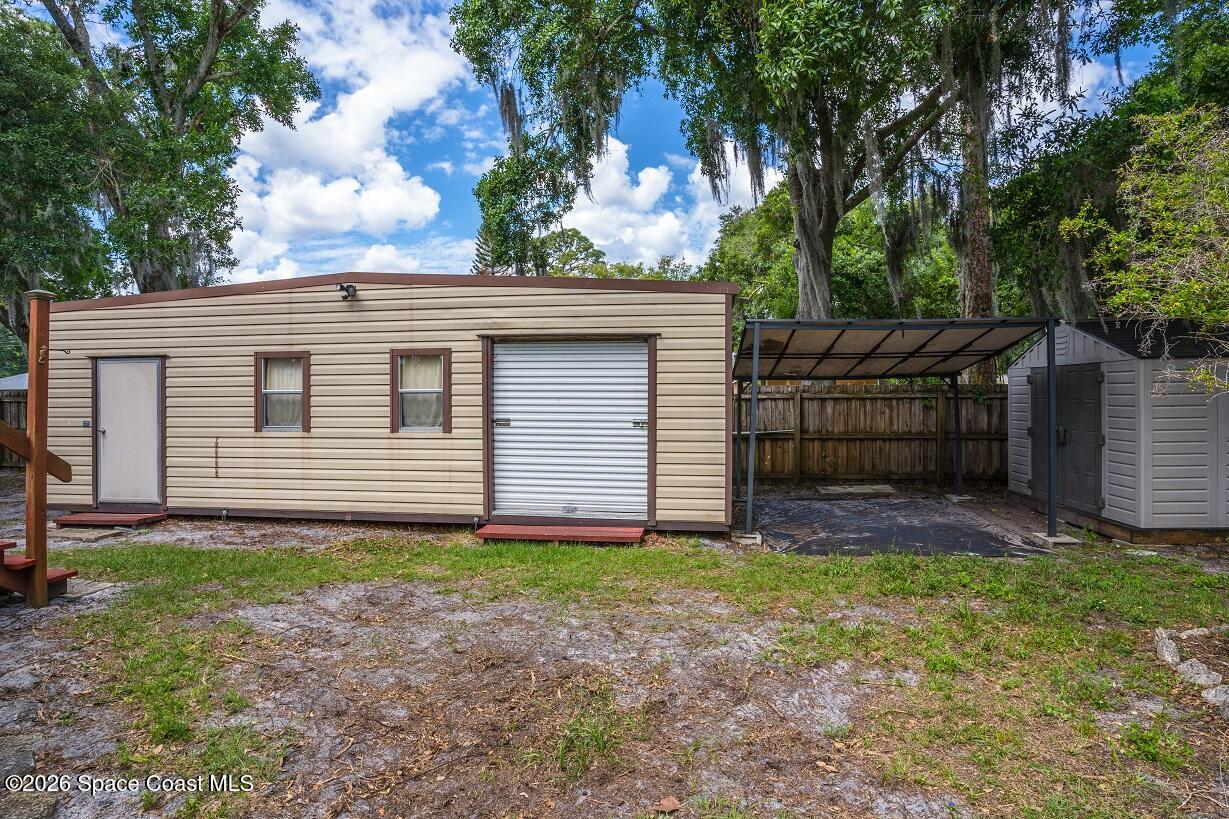1112 Pinedale Road Rockledge, FL 32955 - Photo 13 of 15 a view of a house with a yard