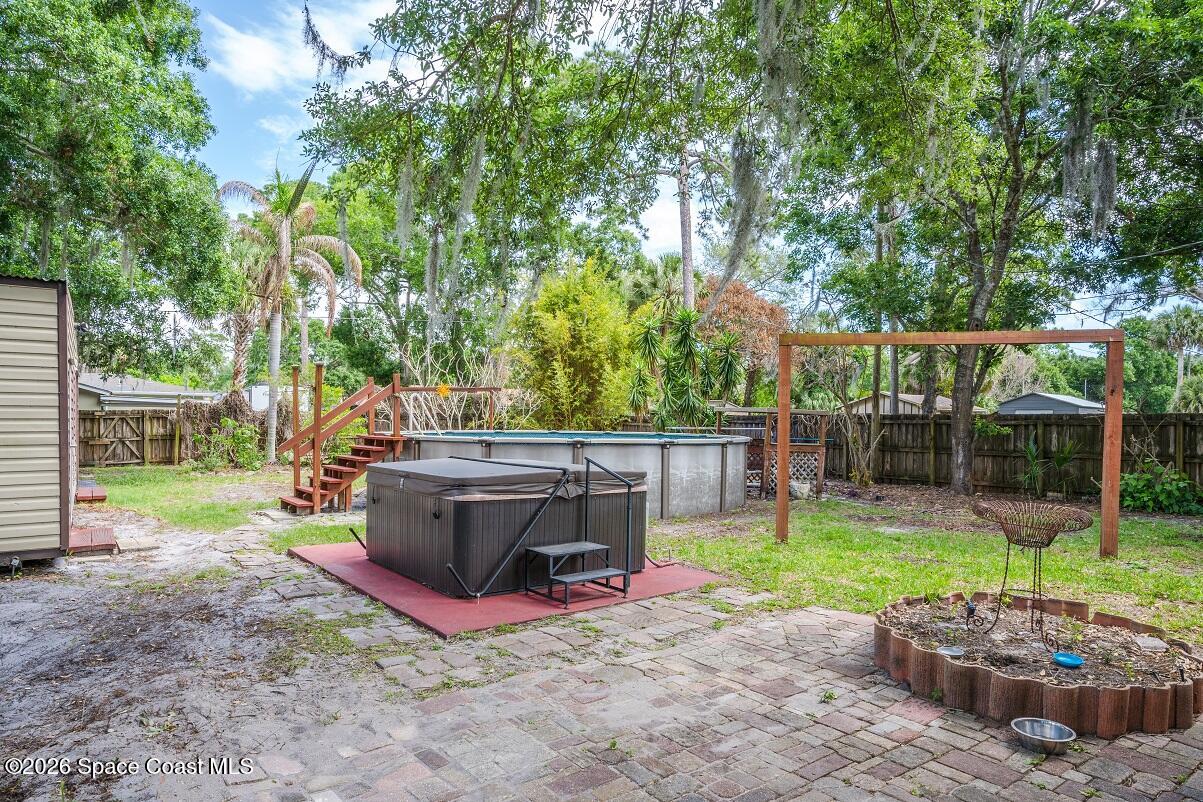 1112 Pinedale Road Rockledge, FL 32955 - Photo 15 of 15 a view of a backyard with a tub