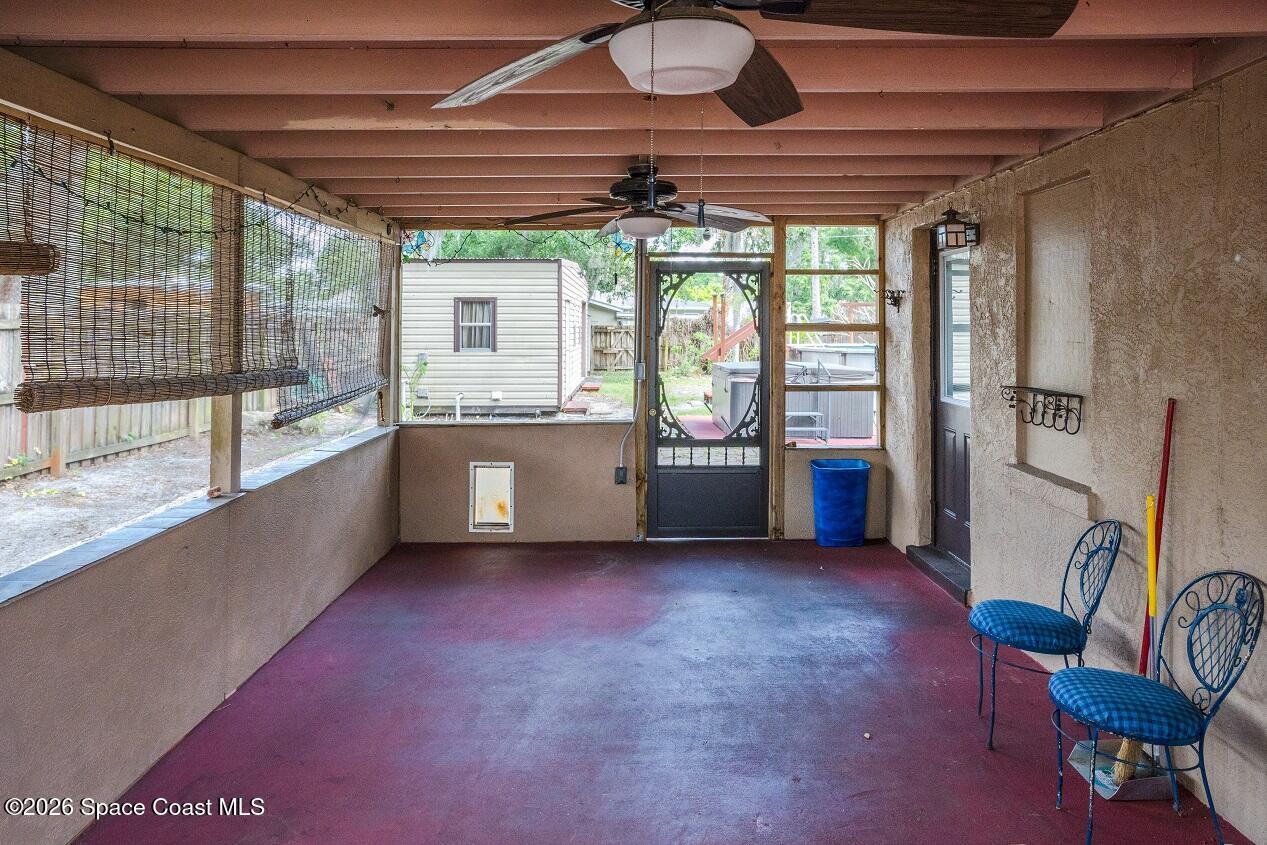 1112 Pinedale Road Rockledge, FL 32955 - Photo 3 of 15 a living room with furniture and a large window