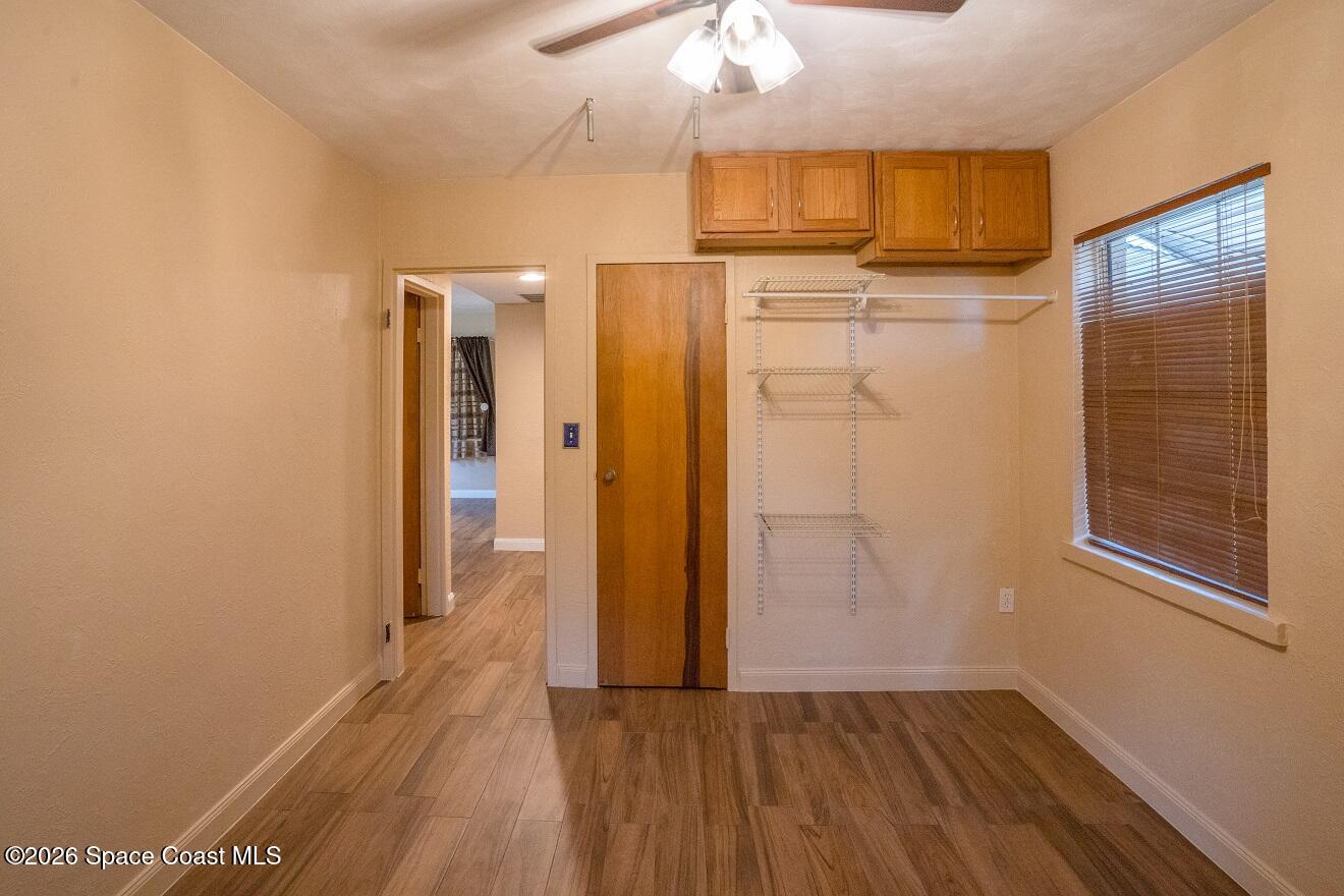 1112 Pinedale Road Rockledge, FL 32955 - Photo 8 of 15 a view of hallway with wooden floor