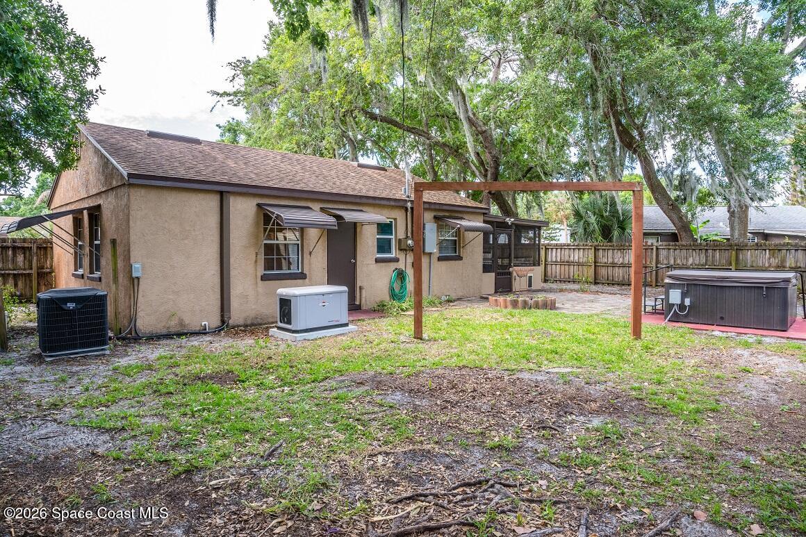 1112 Pinedale Road Rockledge, FL 32955 - Photo 9 of 15 a view of a house with backyard and a tree