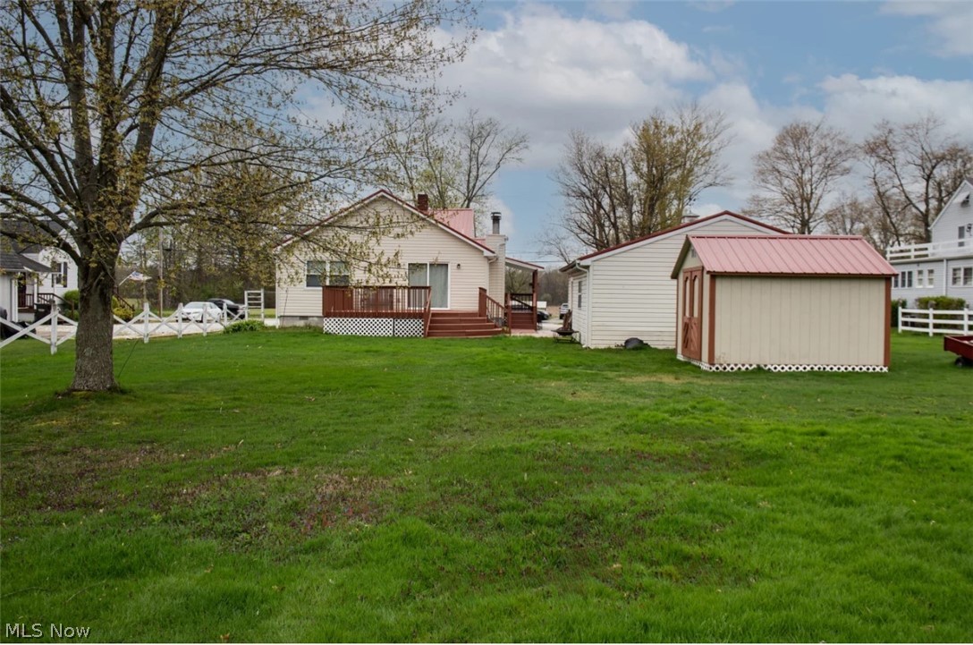 1721 State Road Northwest Warren, OH 44481 - Photo 28 of 37 View of yard with a deck and a storage unit