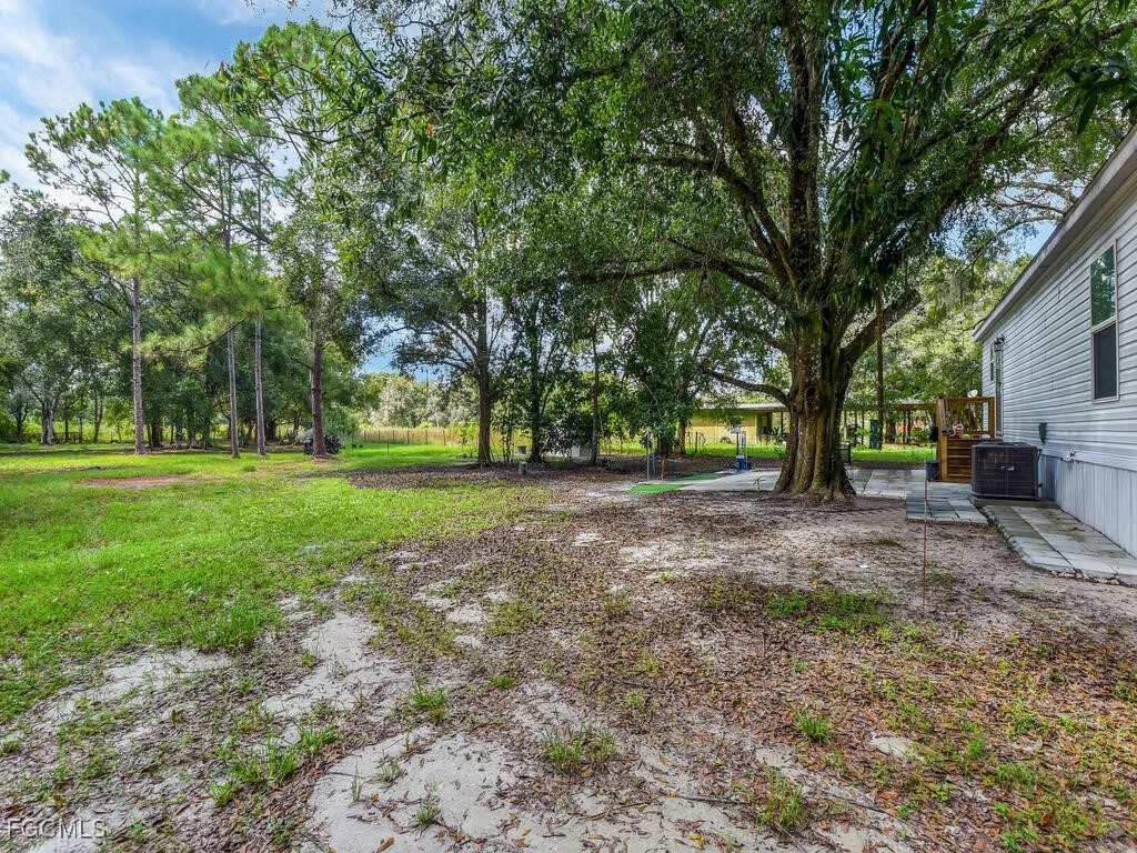 1079 Summerall Road LaBelle, FL 33935 - Photo 22 of 26 a view of outdoor space with trees all around