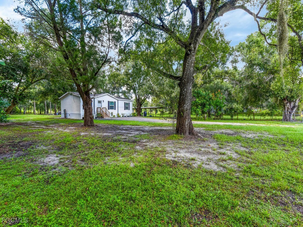 1079 Summerall Road LaBelle, FL 33935 - Photo 25 of 26 a house view with a garden space