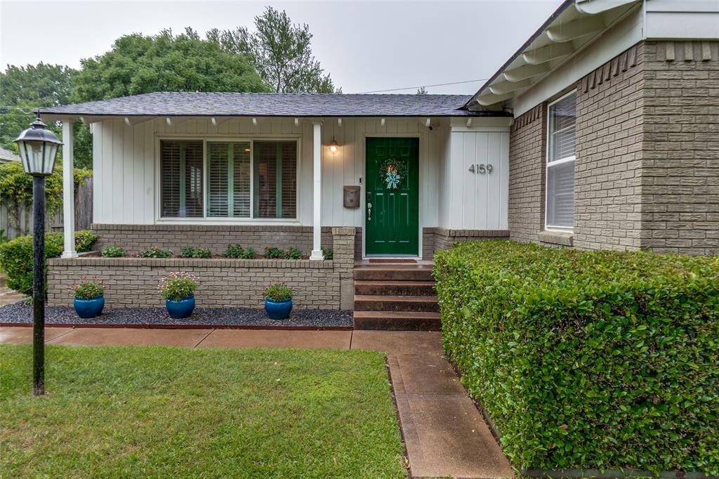 4159 Clover Lane Dallas, TX 75220 - Photo 2 of 25 View of exterior entry featuring brick siding, a shingled roof, and a lawn