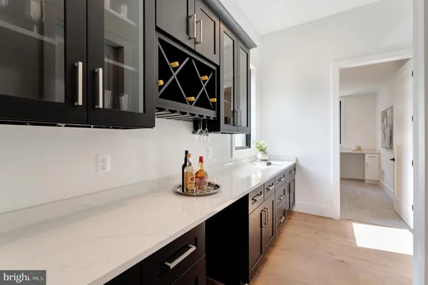 a kitchen with a sink and a stove top oven
