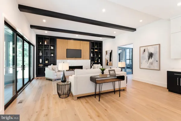 a living room with furniture and large window