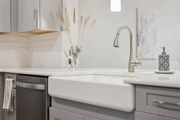 a balcony with chairs and a table in a room