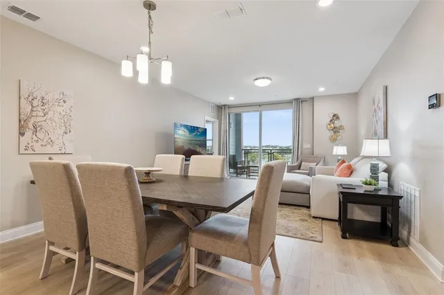 a balcony with chairs and a table in a room