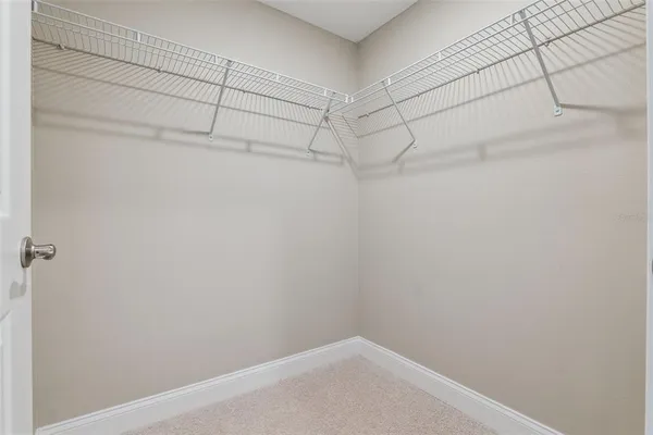 a view of a dining room with furniture and a window