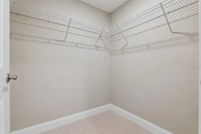 a spacious bedroom with a bed and a couch