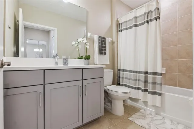 an empty room with a ceiling fan