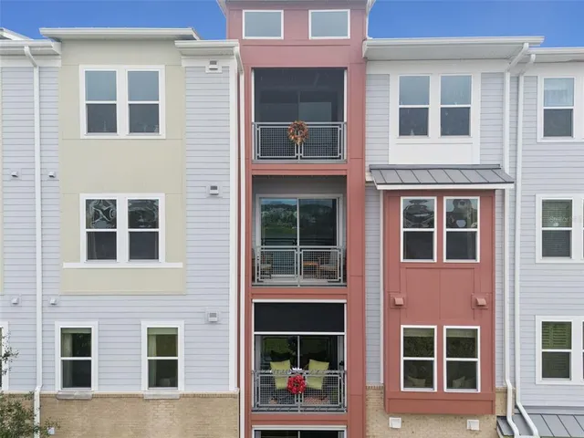 a kitchen with stainless steel appliances kitchen island granite countertop a stove a sink and a refrigerator