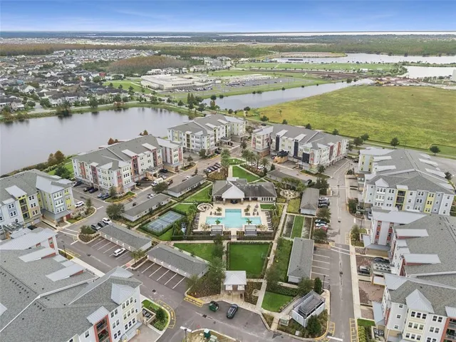 an aerial view of a house with a garden and swimming pool