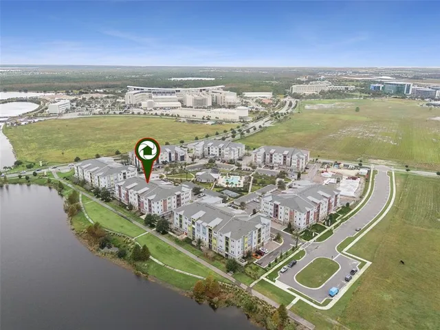 an aerial view of a house with a ocean view