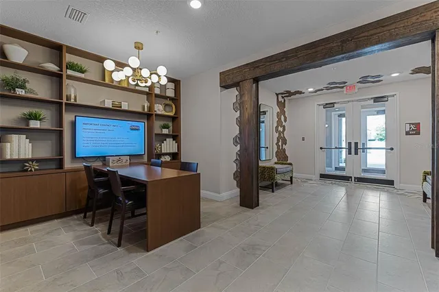 a outdoor living space with furniture and a chandelier