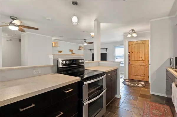 a kitchen with a stove and a refrigerator