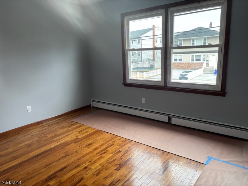 892 Hobson Street Union, NJ 07083 - Photo 8 of 14 a view of an empty room with a window