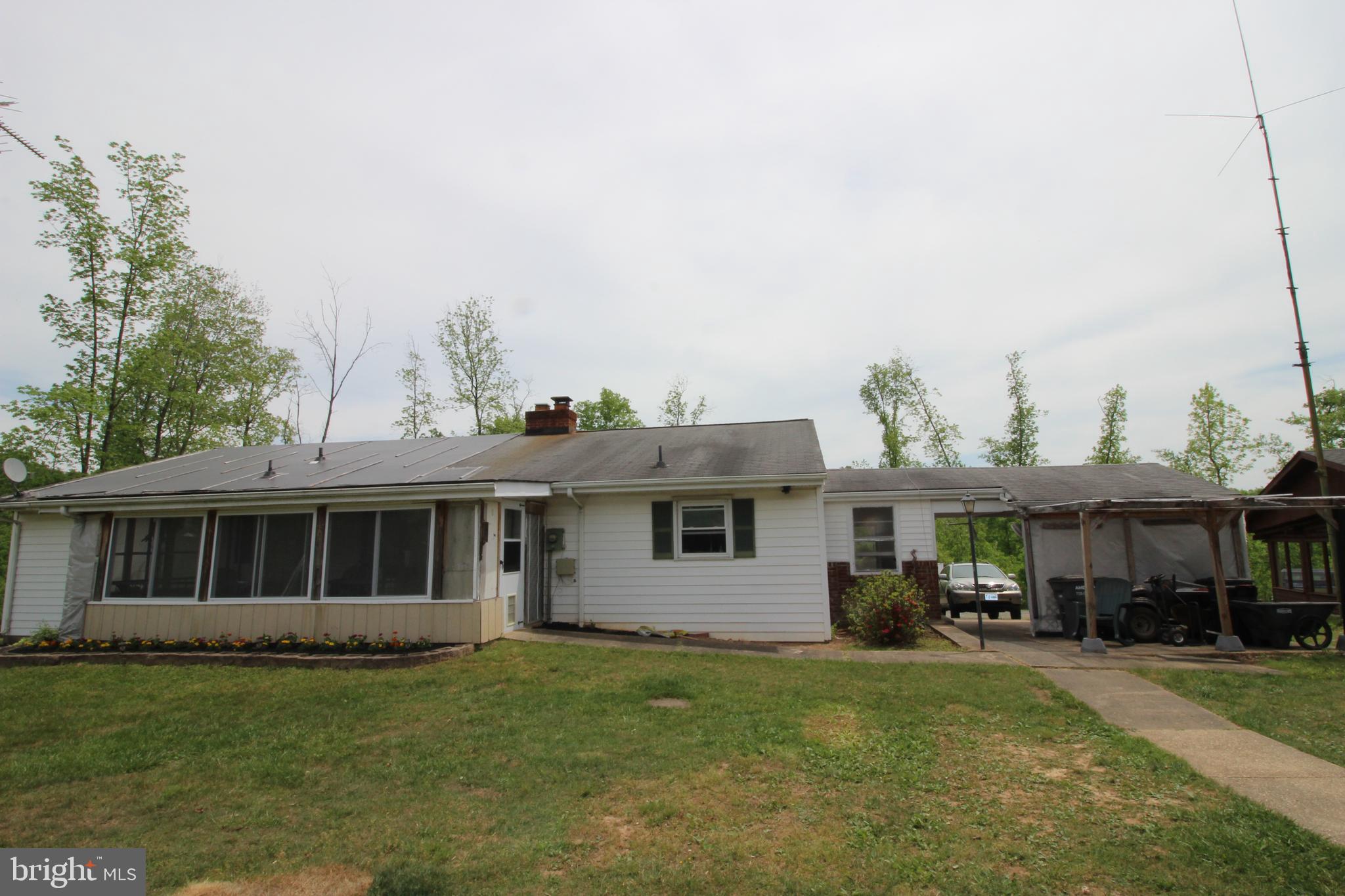10528 Pineview Road Manassas, VA 20111 - Photo 9 of 61 Shows the sunroom and car port from rear