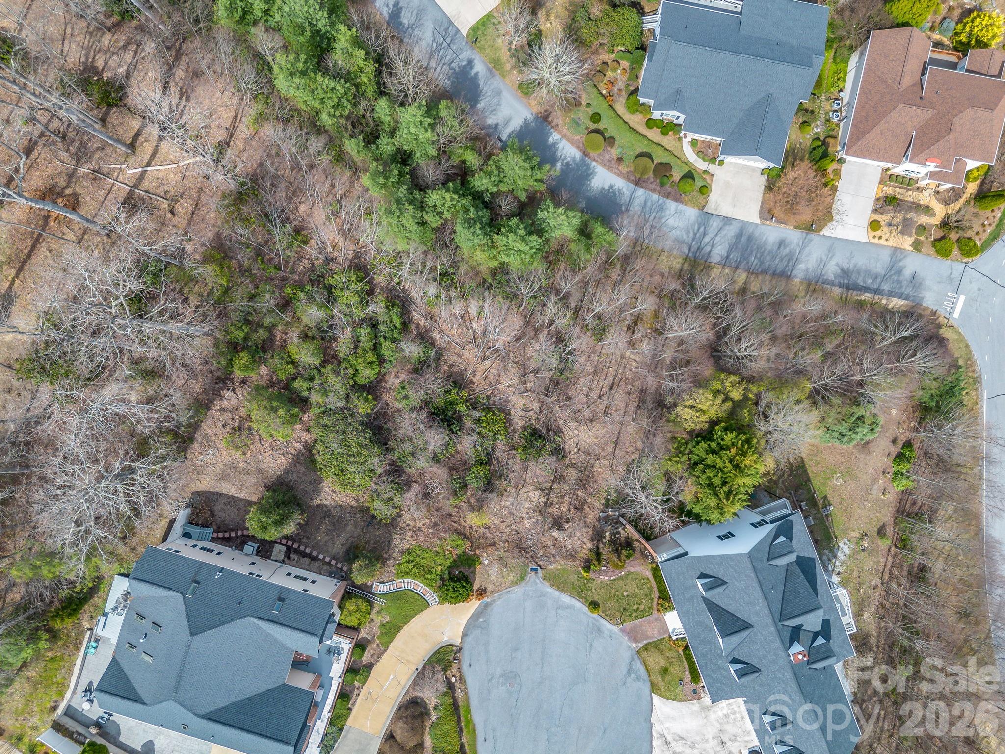 2325 Pommel Road, Unit 2325 Hendersonville, NC 28791 - Photo 3 of 19 an aerial view of a house with a yard