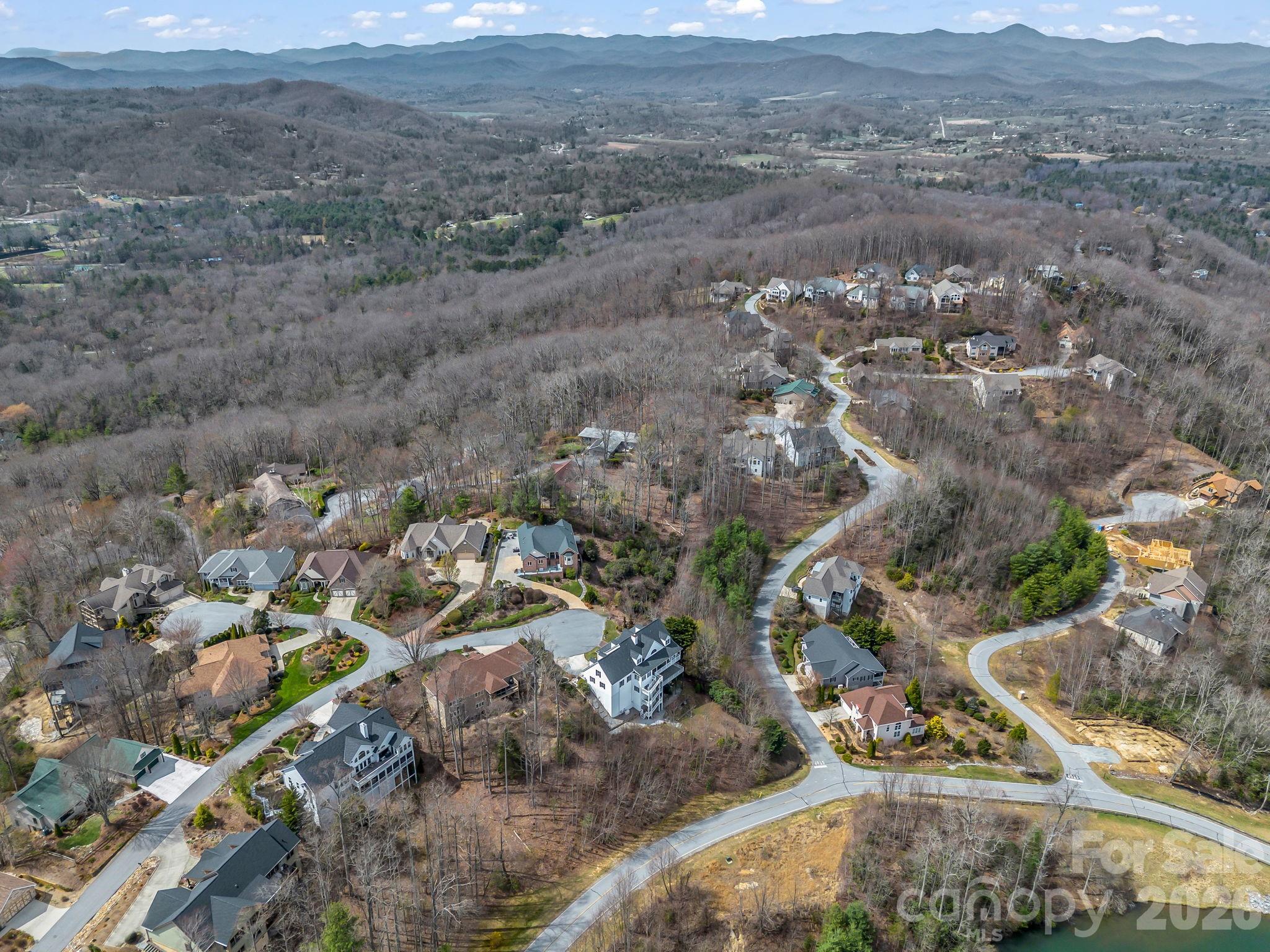 2325 Pommel Road, Unit 2325 Hendersonville, NC 28791 - Photo 10 of 19 a view of a dry field with trees