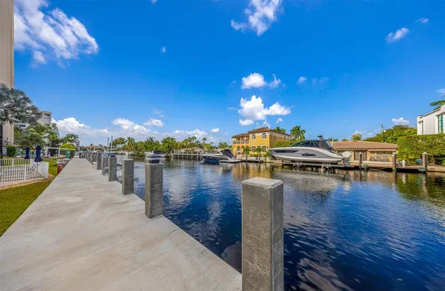 a view of a swimming pool with outdoor seating