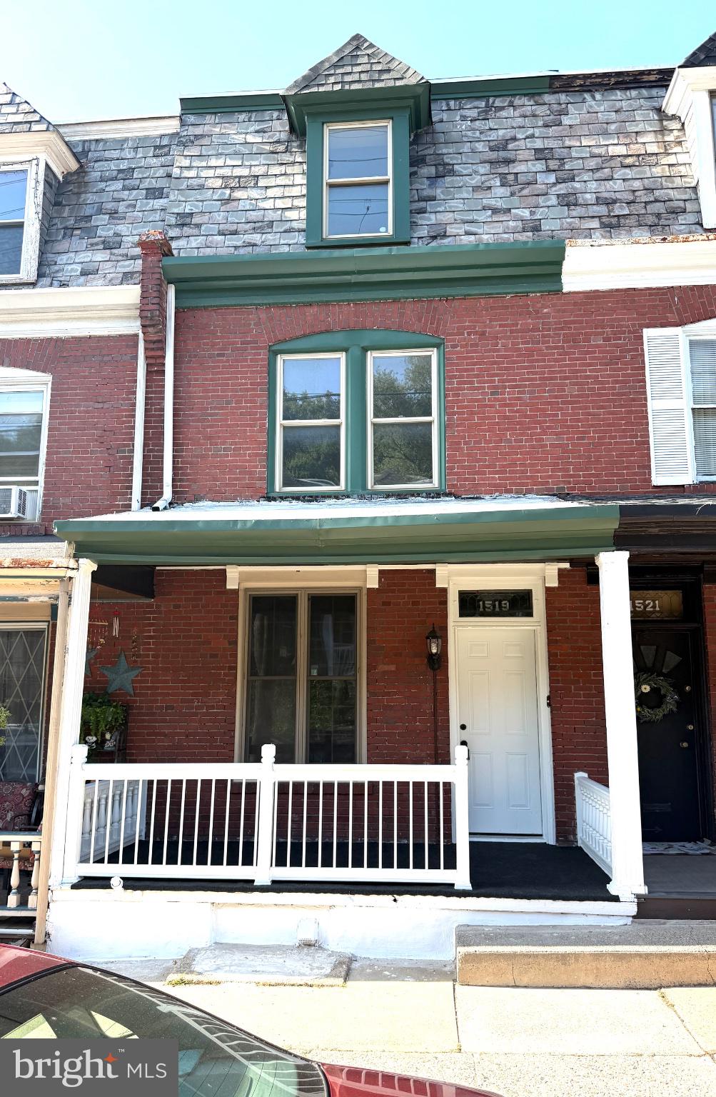 1519 Fairview Street Reading, PA 19606 - Photo 1 of 12 Charming brick facade with green accents.