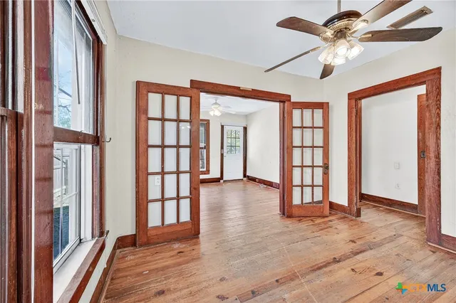 a view of an entryway with wooden floor