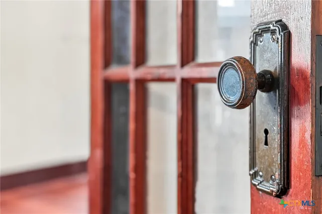 a kitchen with granite countertop a sink and cabinets