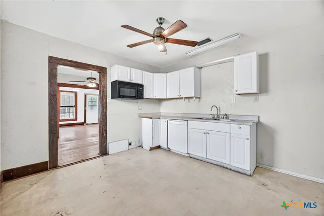 a view of an empty room and wooden floor