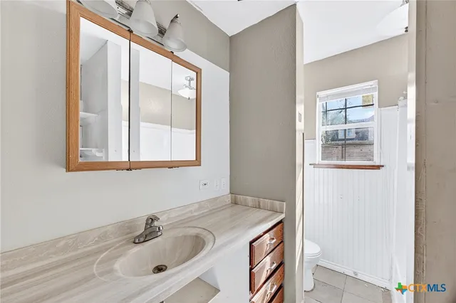 a white bath tub with a window