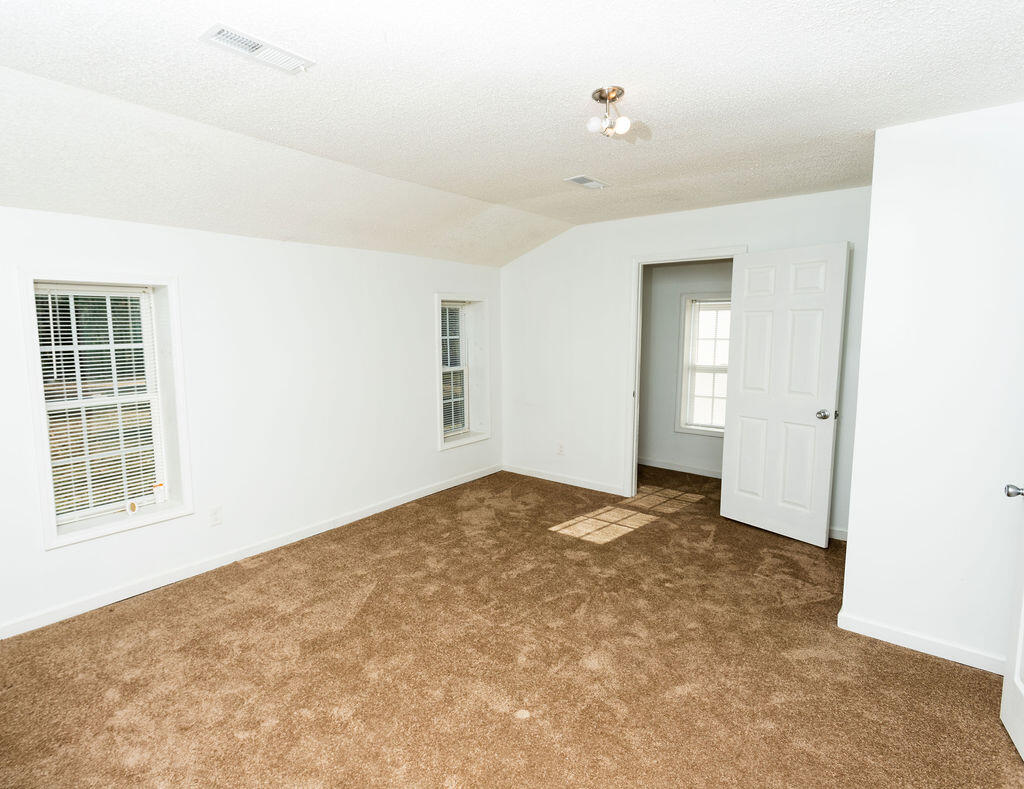 4741 Narrow Paved Road Lynchburg, SC 29080 - Photo 10 of 15 Primary suite. Alcove has a window... can be used as an extra closet, vanity area or book nook.
