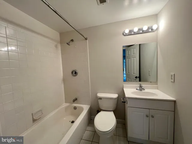 a view of a house with a wooden deck