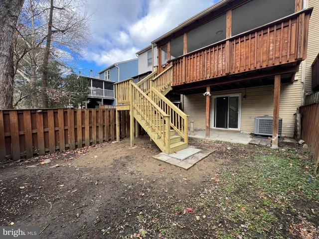 a view of stairs and with yard