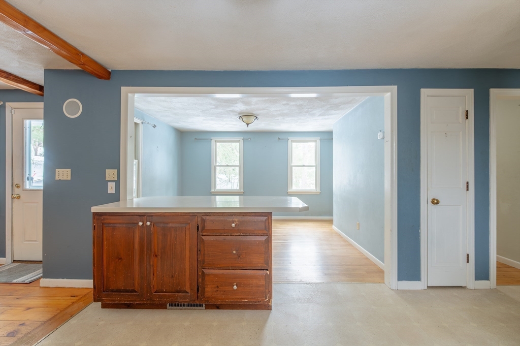 16 Michael Road Bourne, MA 02559 - Photo 13 of 41 a view of a hallway with windows and chandelier