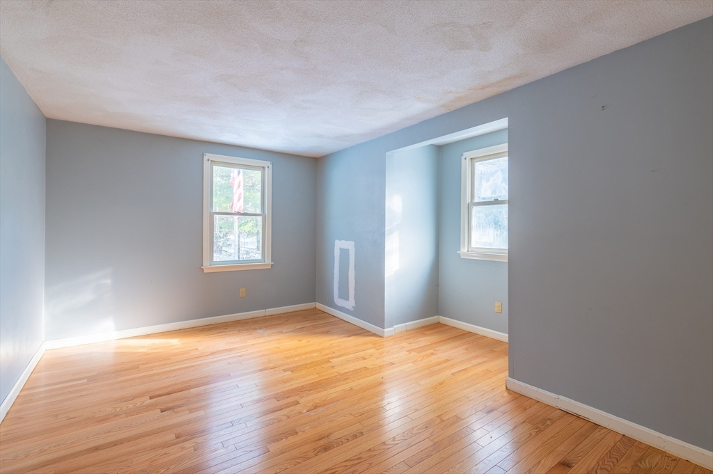16 Michael Road Bourne, MA 02559 - Photo 32 of 41 an empty room with wooden floor and windows