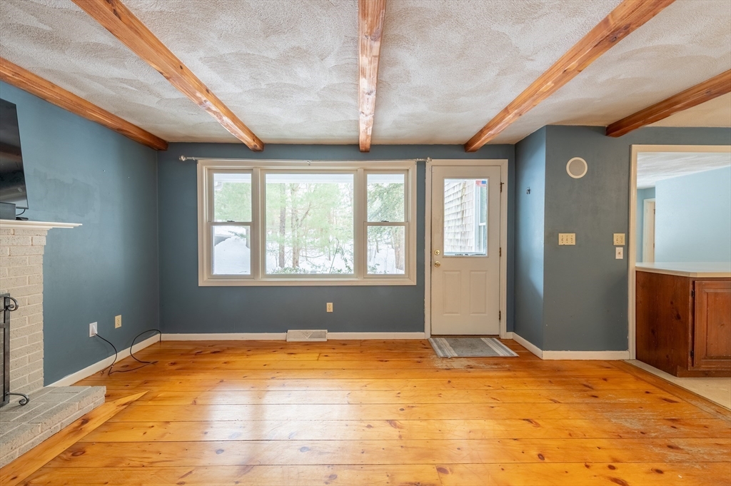 16 Michael Road Bourne, MA 02559 - Photo 9 of 41 a view of an empty room with a window