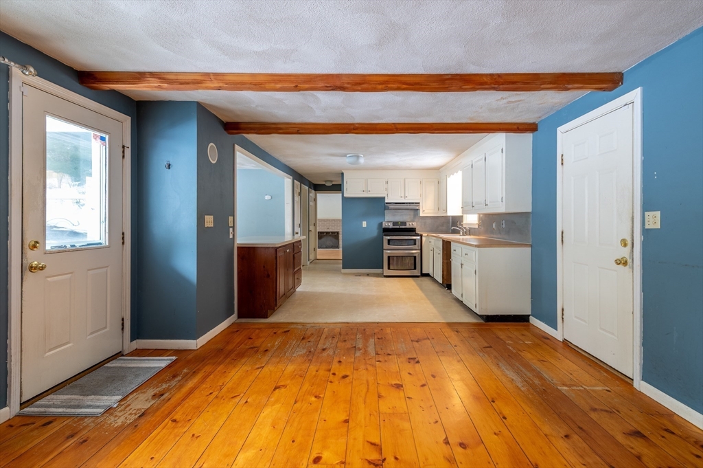 16 Michael Road Bourne, MA 02559 - Photo 10 of 41 a room with stainless steel appliances kitchen island granite countertop a refrigerator stove and sink